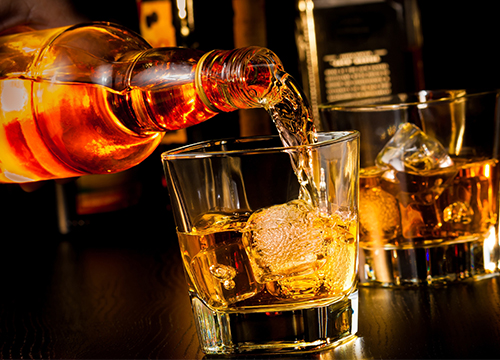 Liquor Being Poured Into Glass